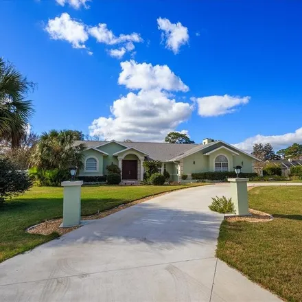 Buy this 4 bed house on 4299 Northeast 64th Avenue in Marion County, FL 34488