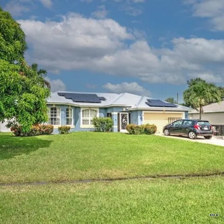 Buy this 3 bed house on 1699 Southeast Simmons Street in Port Saint Lucie, FL 34952