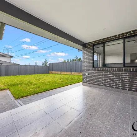 Rent this 5 bed apartment on 11 Limelight Circuit in Gregory Hills NSW 2557, Australia