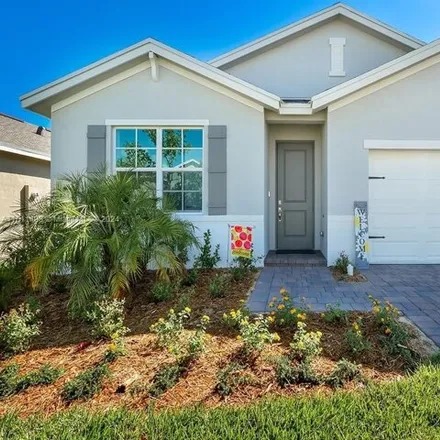 Rent this 4 bed house on Northeast Breezeway Circle in Ocean Breeze, Martin County