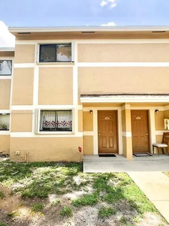 Rent this 2 bed house on 9459 Palm Cir N in Pembroke Pines, Florida