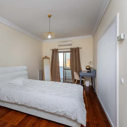 Rent this 8 bed room on Rua Jorge Castilho in 1900-221 Lisbon, Portugal