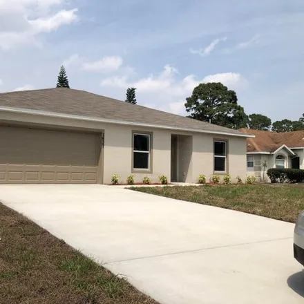 Rent this 3 bed house on 1637 Southwest Lofgren Avenue in Port Saint Lucie, FL 34953