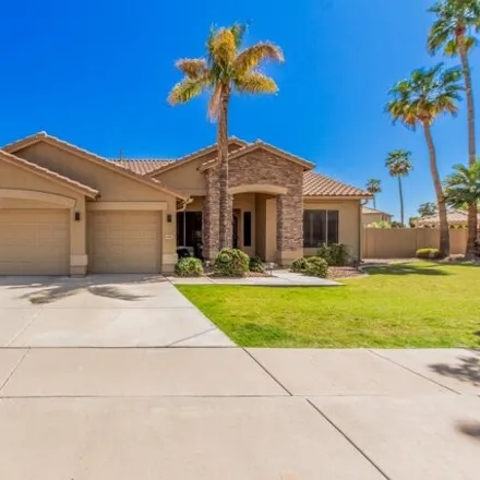 Buy this 4 bed house on 6813 West Grovers Avenue in Glendale, AZ 85308