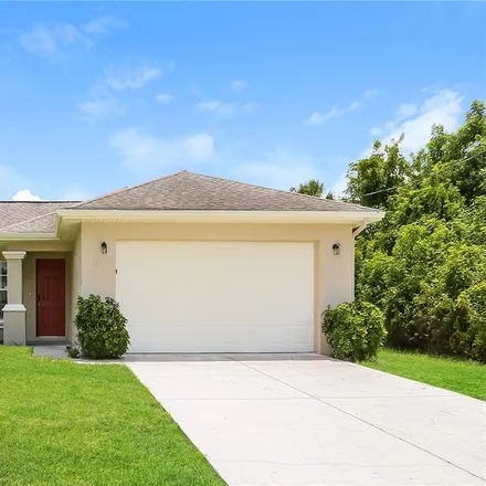 Rent this 3 bed house on 104 Zona Avenue North in Lehigh Acres, FL 33971