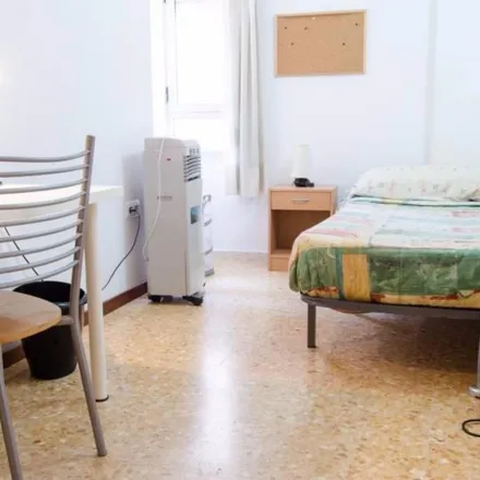 Rent this 6 bed room on Plaça del Poeta Vicente Gaos in 46021 Valencia, Spain