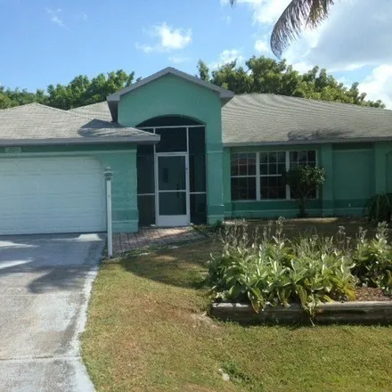 Rent this 3 bed house on 1803 Northeast 3rd Street in Cape Coral, FL 33909