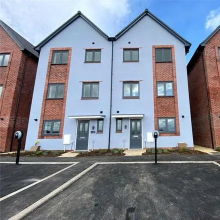 Rent this 4 bed townhouse on Kilby Road in Stoke Gifford, BS34 8DJ