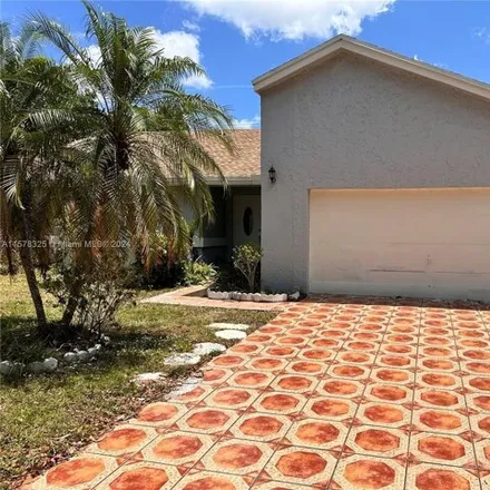 Rent this 4 bed house on 7308 Northwest 44th Court in Lauderhill, FL 33319