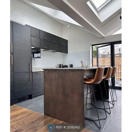 Rent this 4 bed townhouse on Drummond Money Transfer & Travel Services in Drummond Street, London