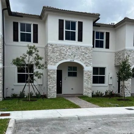 Rent this 3 bed house on 12074 NW 24th Pl in Miami, Florida