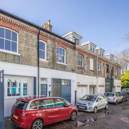 Buy this 4 bed townhouse on Robin's Garage in Unit D Cambridge Grove, Hove