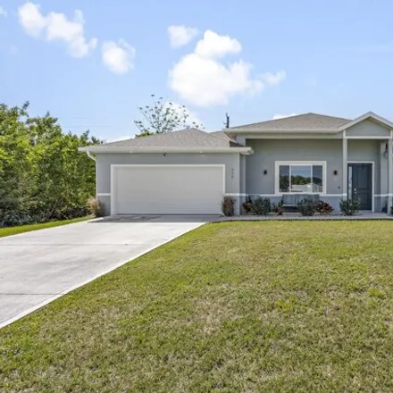 Buy this 5 bed house on 895 Starland Street Southeast in Palm Bay, FL 32909