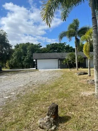 Rent this 4 bed house on 13568 52nd Court North in Palm Beach County, FL 33411