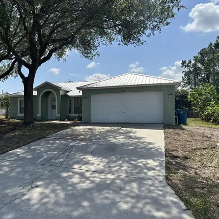 Rent this 3 bed house on 1023 Hanson Avenue Southwest in Palm Bay, FL 32908