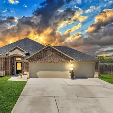 Buy this 4 bed house on 11819 Champions Forest Dr in Mont Belvieu, Texas