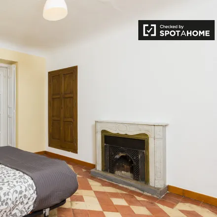 Rent this 9 bed room on Madrid in El Cogollo de la Descarga, Calle de las Hileras