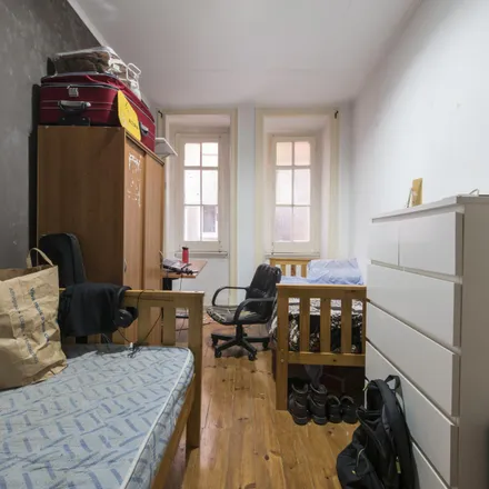 Rent this 4 bed room on Rua Marquês Sá da Bandeira 64 in 1050-150 Lisbon, Portugal
