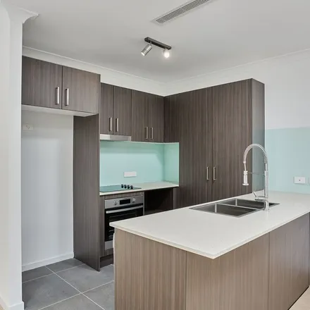 Rent this 4 bed townhouse on Nikau Crescent in Gold Coast City QLD 4211, Australia