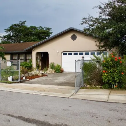 Buy this 4 bed house on 1478 Canal Street in Belle Glade Camp, Palm Beach County