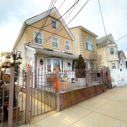 Buy this 4 bed house on 97-36 99th St in Ozone Park, New York