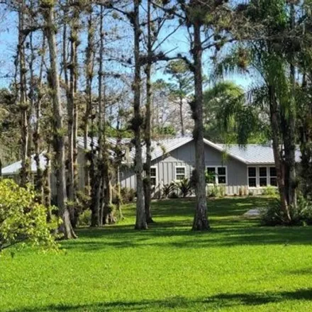 Buy this 4 bed house on 13028 Compton Road in Loxahatchee Groves, FL 33470