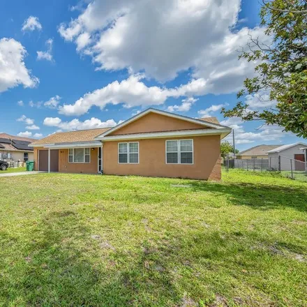 Buy this 3 bed house on 763 Northwest Bayard Avenue in Port Saint Lucie, FL 34983