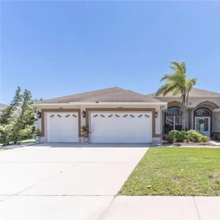 Buy this 4 bed house on 13420 Weatherstone Drive in Spring Hill, FL 34609