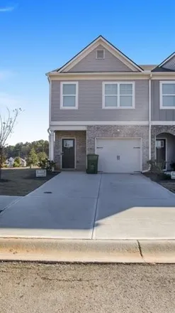 Rent this 3 bed townhouse on Lithonia Industrial Boulevard in Stonecrest, GA 30058