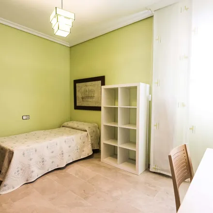 Rent this 4 bed room on CajaSol in Calle Hernán Ruiz, 41006 Seville