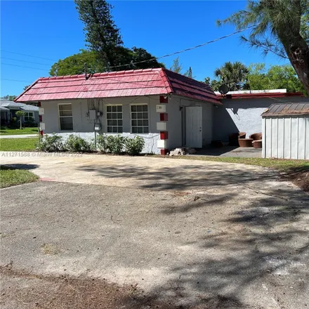 Rent this 3 bed house on 2701 Northwest 18th Terrace in Middle River, Broward County