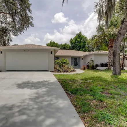 Buy this 4 bed house on 8722 Forest Lake Drive in Jasmine Estates, FL 34668