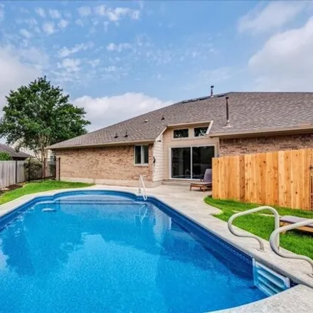 Buy this 4 bed house on 10904 Split Stone Way in Austin, TX 78739
