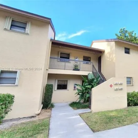 Rent this 2 bed condo on Cocoplum Circle in Coconut Creek, FL