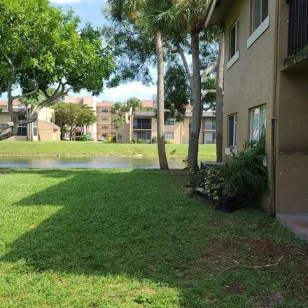Rent this 3 bed apartment on 1176 Lake Terry Drive in Golden Lakes, Palm Beach County