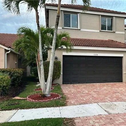 Rent this 4 bed house on 1374 Majesty Terrace in Weston, FL 33327