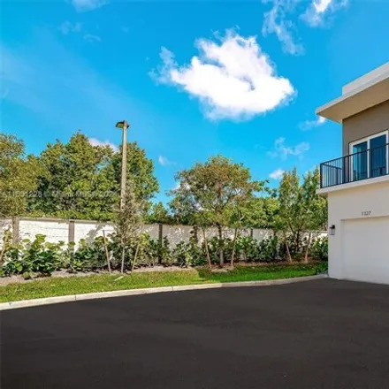 Rent this 3 bed house on 1319 Northwest 27th Avenue in Collier Park, Pompano Beach