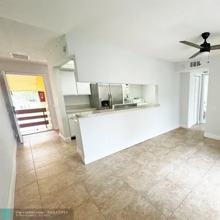 Rent this 2 bed apartment on 4472 Treehouse Lane in Tamarac, FL 33319