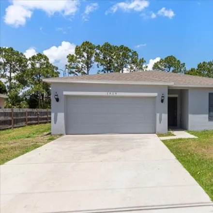 Rent this 3 bed house on 1919 Southwest Fears Avenue in Port Saint Lucie, FL 34953