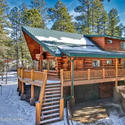 Buy this 4 bed house on 3831 Turkey Track Rd in Pinetop, Arizona