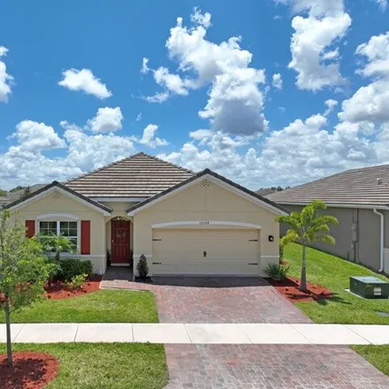 Buy this 4 bed house on 12324 Sw Arabella Dr in Port Saint Lucie, Florida