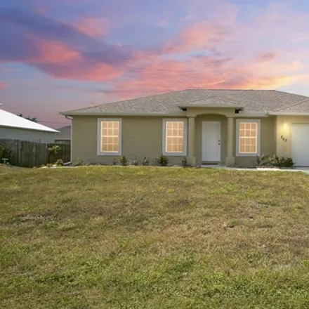 Buy this 4 bed house on 844 Southwest Haas Avenue in Port Saint Lucie, FL 34953