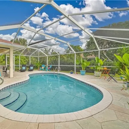 Buy this 3 bed house on 4453 Varsity Lakes Drive in Lehigh Acres, FL 33971