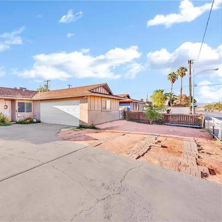 Buy this 4 bed house on 1268 South Sandhill Road in Las Vegas, NV 89104