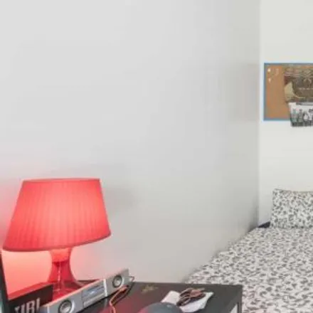 Rent this 4 bed room on Rua António Pereira Carrilho 7 in 1000-047 Lisbon, Portugal