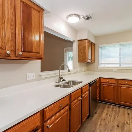 Rent this 4 bed apartment on 16449 Hidden Gate Court in Fort Bend County, TX 77498
