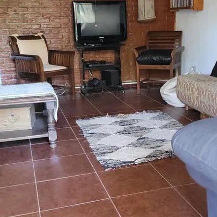 Buy this 4 bed house on Calle 308 in Partido de Villa Gesell, Villa Gesell