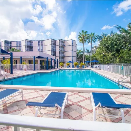 Rent this 2 bed apartment on 7075 Northwest 186th Street in Country Club, Miami-Dade County