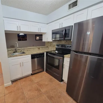 Rent this 2 bed condo on 1074 Coral Club Drive in Coral Springs, FL 33071