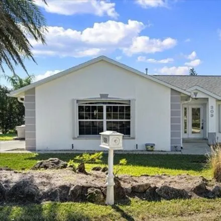 Buy this 4 bed house on 309 Hillsboro Street in New Smyrna Beach, FL 32169